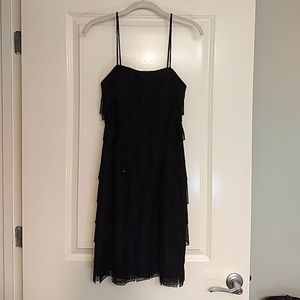 Black spaghetti strap cocktail dress.